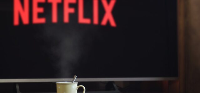 photo of cup near flat screen television