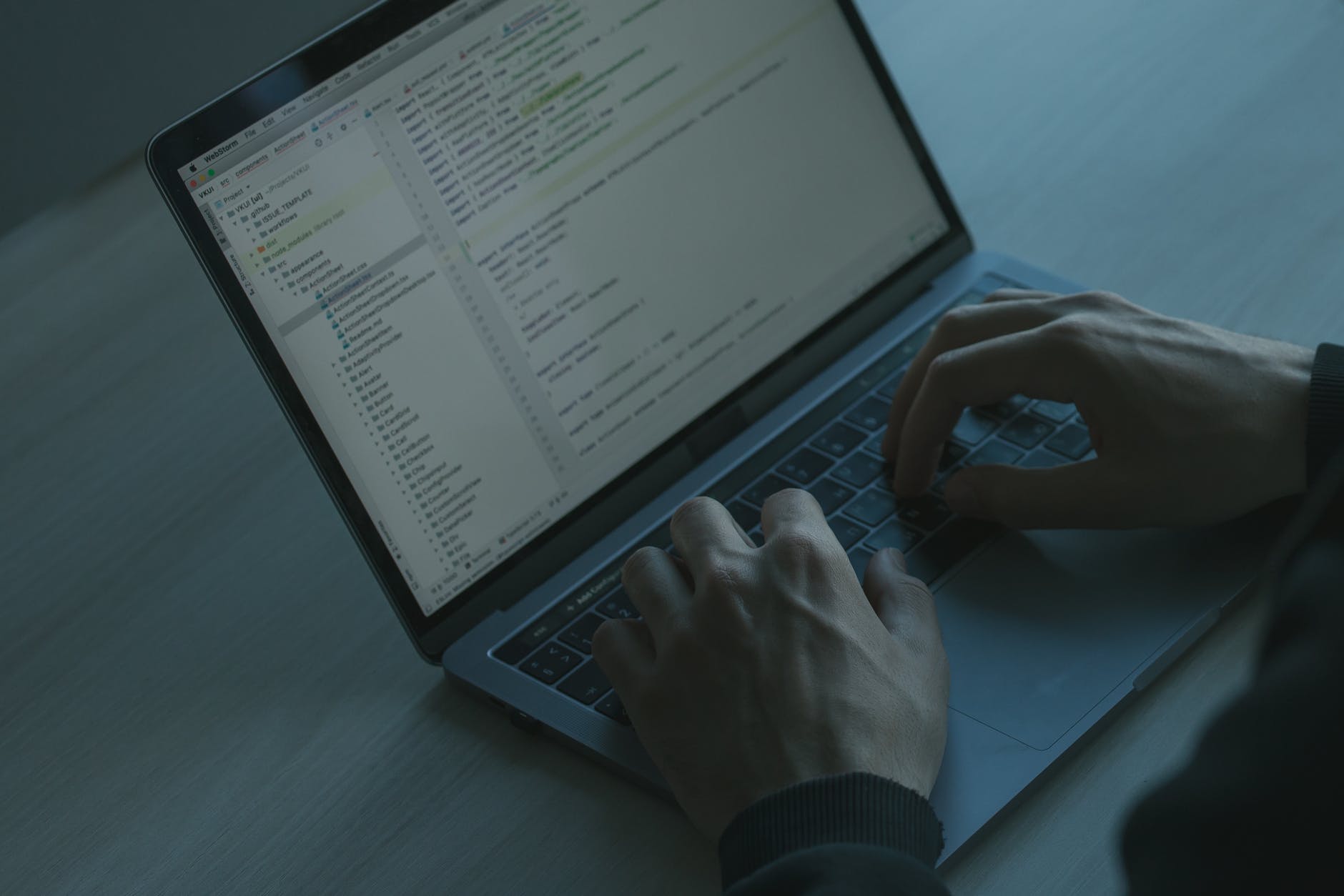 hands on a laptop keyboard