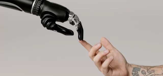 bionic hand and human hand finger pointing