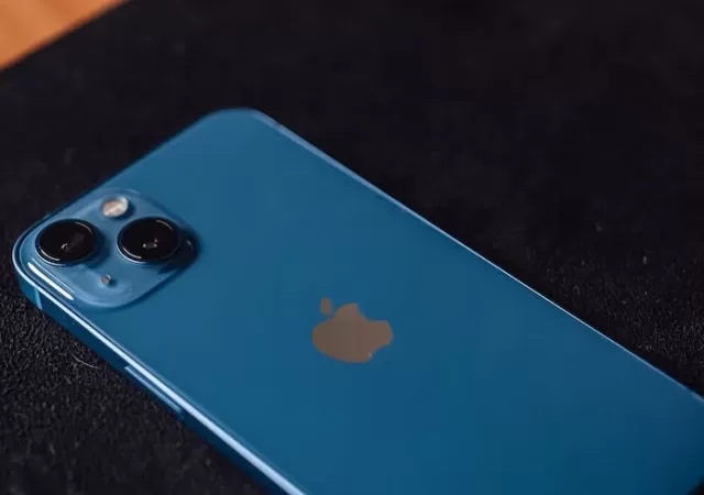 a blue iphone on the table