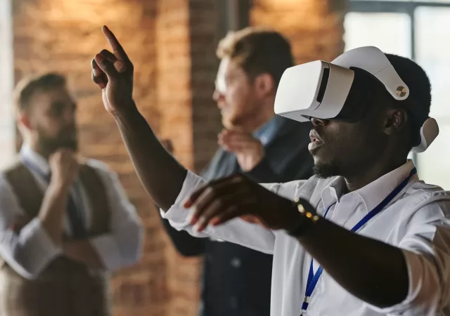 photo of a man wearing virtual reality headset