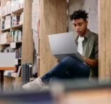 African,American,Student,E learning,On,Laptop,During,A,Research,In