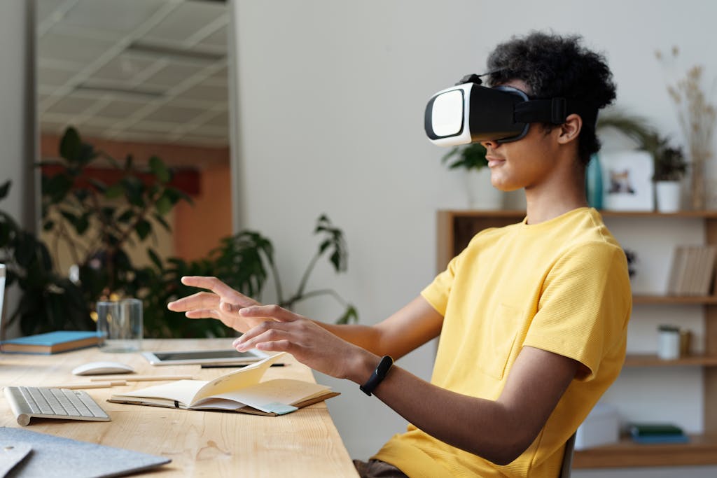 Teenager wearing a VR headset and interacting in a home setting, enjoying virtual reality experience.