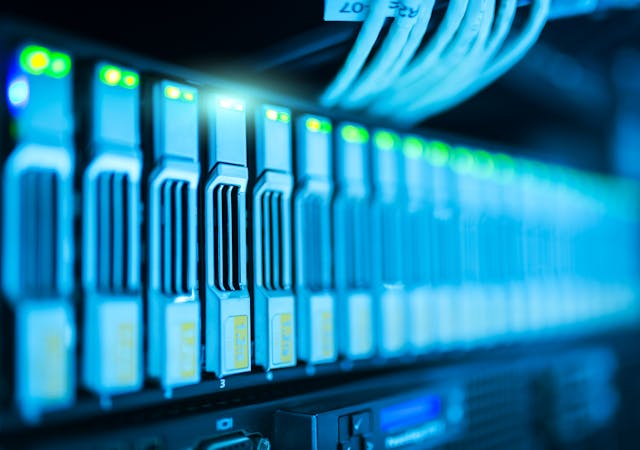 Detailed image of a server rack with glowing lights in a modern data center.